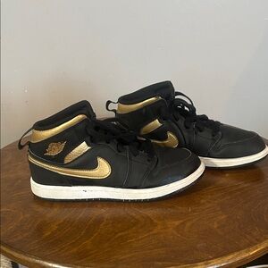 Air Jordan Nike Black and Gold Mid-Top Sneakers